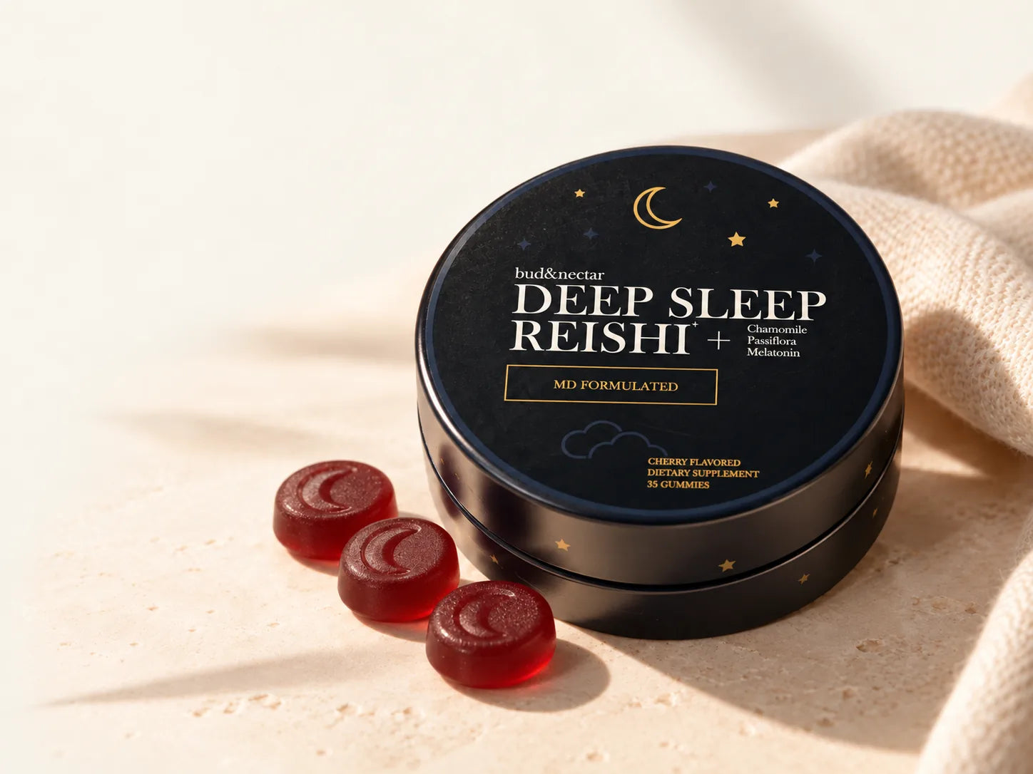 Deep Sleep Reishi tin with three cherry gummies on a softly lit surface